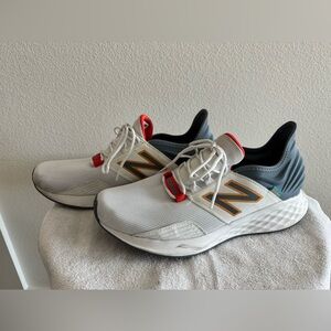 New Balance Men's White Athletic Sneakers with Red and Navy Accents